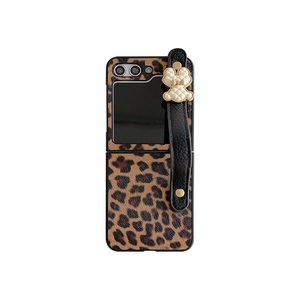 Leopard print folding phone case with black wrist strap and cream bear charm
