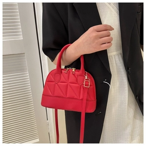 Quilted red shell-shaped handbag with adjustable strap for women in fashion style