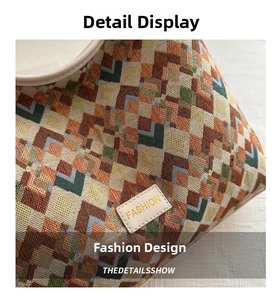 Detailed macro view of geometric woven fabric bag with a stitched Fashion leather label