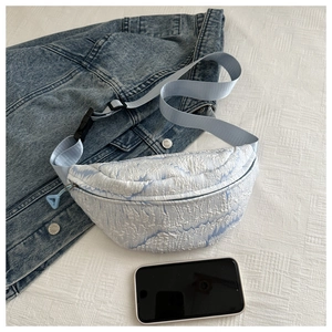Detail view of the light blue marble texture fabric on this casual crossbody bag