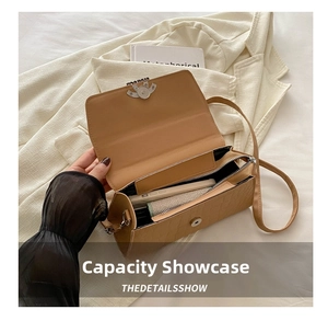 Interior view showing the capacity of the khaki crocodile textured crossbody bag