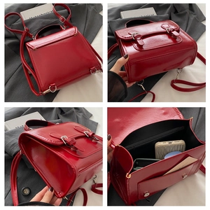 Detailed views of vintage red patent leather backpack with dual straps and inner pockets