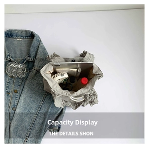 Detail view of large capacity gray nylon tote bag with drawstring and daily essentials