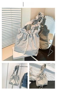 Detailed views of grey ruched tote bag featuring drawstring closure and silver studs