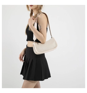 Chic cream straw textured shoulder bag with silver studded wide strap detail