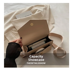 Internal view of beige crossbody bag showing dual compartments for smartphone and essentials