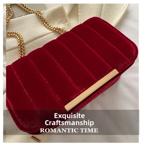Detailed macro of red velvet texture with quilted pattern and gold chain strap