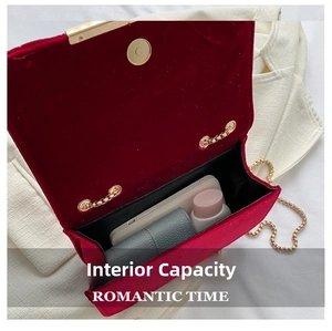 Interior capacity of the velvet chain bag showing space for phone and cosmetics