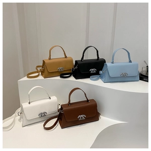 Detailed arrangement of structured minimalist handbags in yellow, black, blue, white, and brown