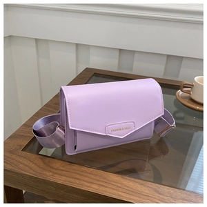 Detail of lavender PU leather crossbody bag with wide strap and embossed fashion text
