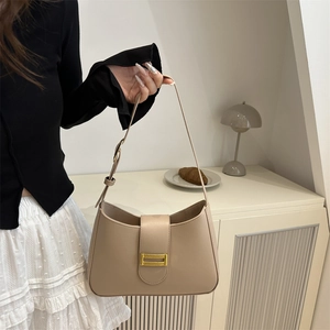 Minimalist apricot vegan leather underarm bag with gold metal buckle and adjustable strap