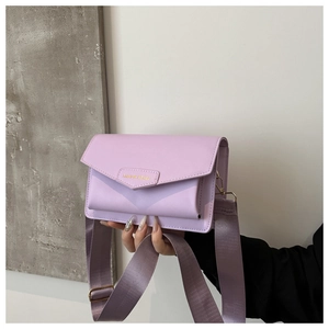 Detail of lavender PU leather crossbody bag with adjustable wide nylon strap