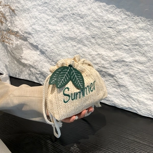 Handheld straw bucket bag with Summer leaf embroidery and white drawstring closure