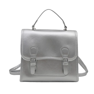 Chic silver metallic backpack with top handle and double buckle flap for women
