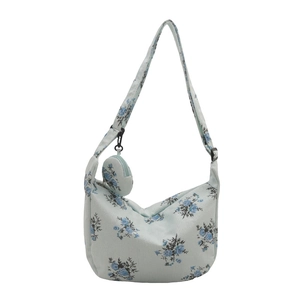 Blue corduroy crescent bag with floral print and adjustable strap for women