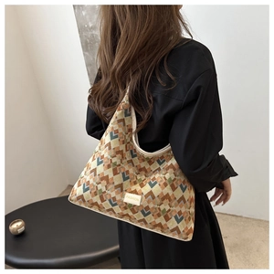 Detail of the geometric knit pattern and Fashion label on this stylish tote bag