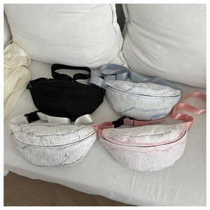 Detail view of colorful cloud texture crossbody bags with adjustable straps in four styles