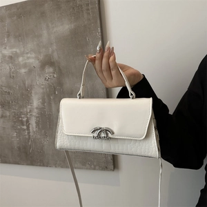 Stylish off-white crossbody bag with crocodile texture and elegant silver metal buckle