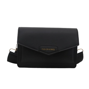 Classic black leather messenger bag with flap closure and wide woven shoulder strap