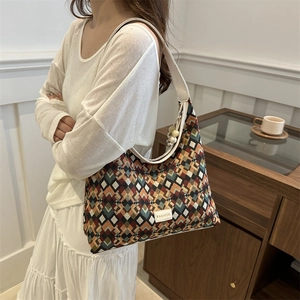 Bohemian rhombus pattern hobo bag with fashion label and cream leather strap