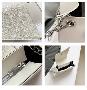 Détails de cuir blanc façon crocodile, chaîne argentée et fermeture éclair du sac à main