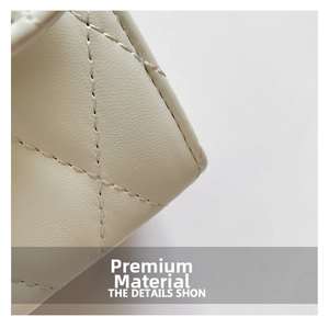 Close-up of beige quilted faux leather texture with elegant diamond stitching details