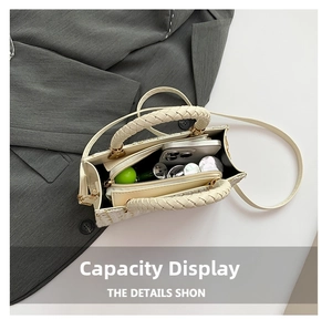 Detailed interior view of the tweed handbag showing storage capacity for phone and cosmetics