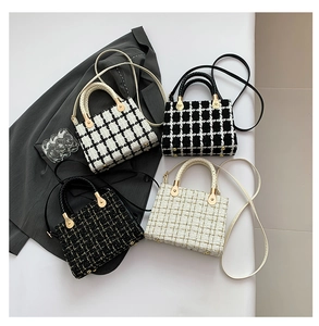 Flat lay of tweed crossbody bags in various colors with gold hardware and top handles