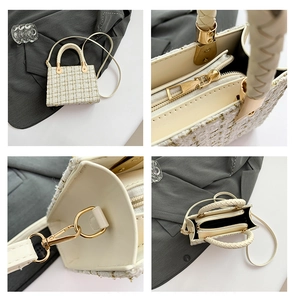 Macro detail of beige tweed fabric with gold threads and interior zipper compartment