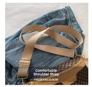 Detail of adjustable beige woven strap and golden buckle on retro crossbody waist bag