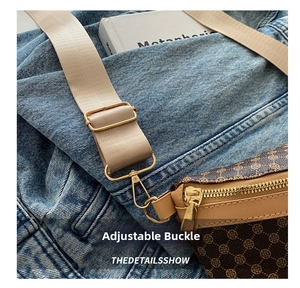 Detail of adjustable buckle and wide nylon strap on vintage patterned fanny pack