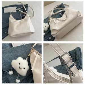 Detailed views of a white hobo bag with adjustable strap, silver chain, and plush charm