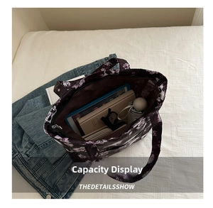 Internal view of purple floral tote bag showing spacious capacity for daily essentials