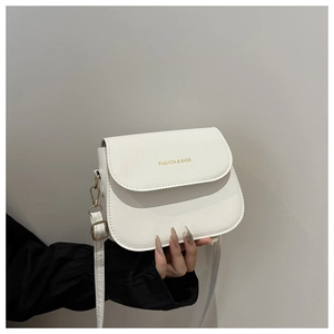Close-up of white crossbody bag with gold Fashion & Bags logo and slim shoulder strap