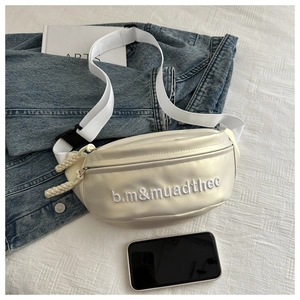 Detail showing white dumpling bag interior capacity with a smartphone as a size reference