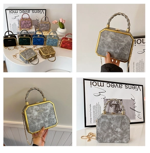 Octagonal rigid box bag with marble texture, gold metal trim, and woven handle details