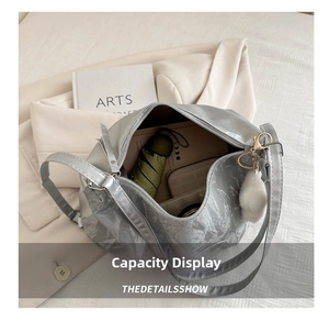 Top view of large silver tote bag interior showing spacious capacity for daily essentials