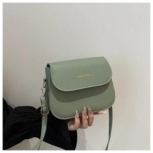 Detail of sage green matte PU leather crossbody bag with golden Fashion & Bags text