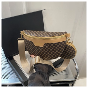 Detailed macro view of vintage brown pattern leather chest bag with gold zipper and wide strap