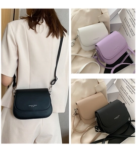 Detail view of saddle crossbody bags in four colors with adjustable shoulder straps