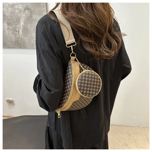 Detail of dark brown vintage fanny pack with golden geometric print and small round pouch