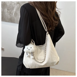 White large capacity hobo bag with marble texture, silver chain, and plush charm
