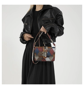 Crossbody square bag featuring colorful geometric patchwork and metallic textures on model