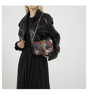 Detailed shot of multi-color leather patchwork on a stylish rectangular crossbody bag