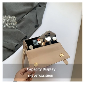 Detail view of the beige small square bag showing interior capacity for phone and makeup