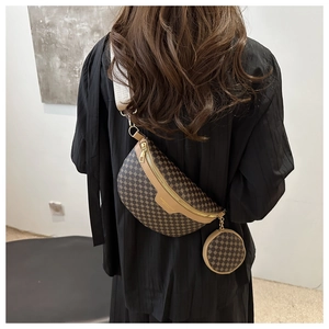 Detail of vintage patterned chest bag with mini round pouch and wide woven strap