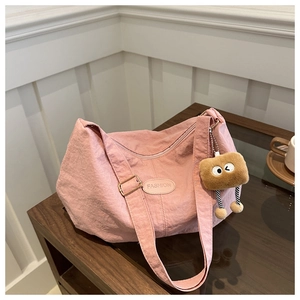Pink large capacity nylon tote bag detail with fashion patch and plush cookie charm
