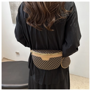Detail of a brown geometric print waist bag with detachable round coin purse on a model