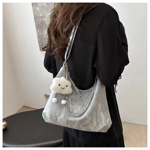 Silver wrinkled hobo bag with metal chain strap and white plush cloud pendant