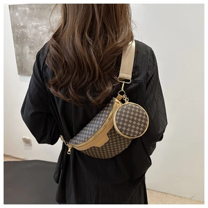Detailed view of vintage print waist bag with detachable round coin purse and wide strap